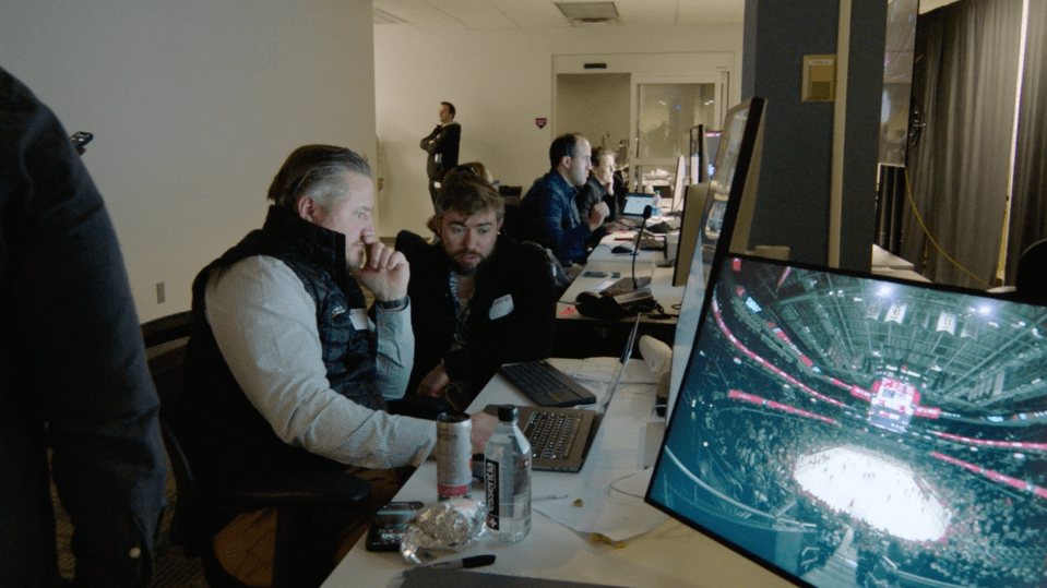 Detail of a broadcast professional managing live transmission of NHL event.