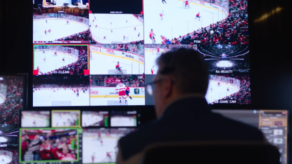Broadcast professional managing live transmission of NHL event.