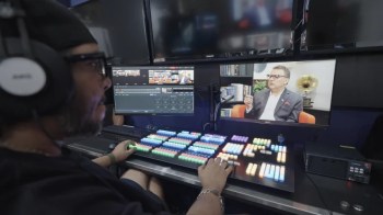 NIN9 team professional managing a podcast production in the new studio built with Ideal Systems