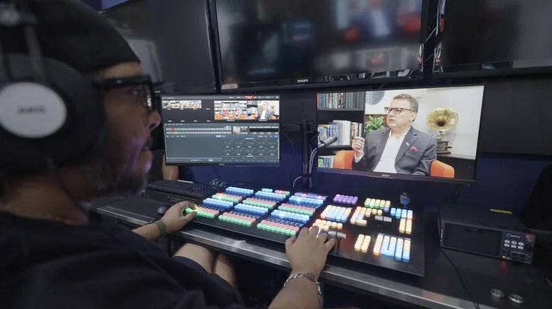 NIN9 team professional managing a podcast production in the new studio built with Ideal Systems